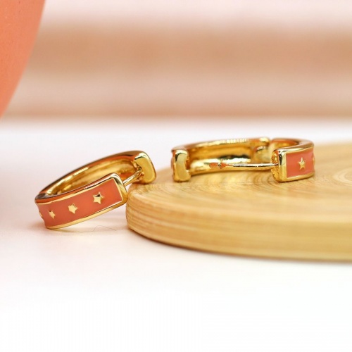 Golden Huggie Hoop Earrings with Orange Enamel & Stars by Peace of Mind